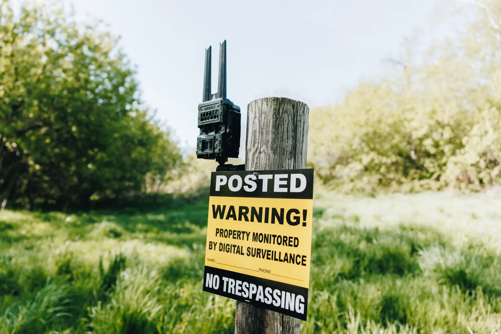 HF4K security camera mounted on a no trespassing post